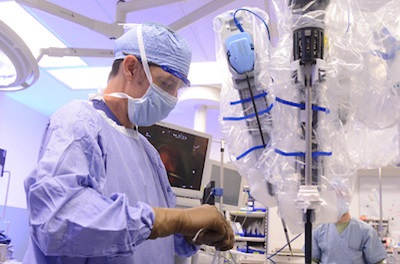 Doctor performing TORS procedure